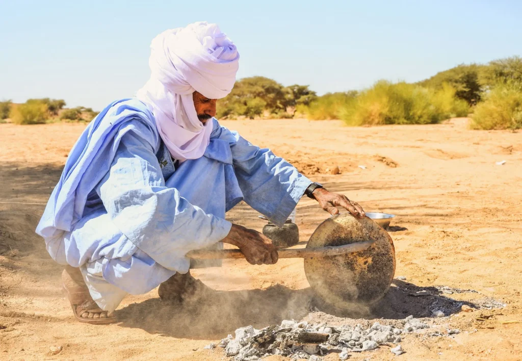The sand-baking process of Taguella in the desert.